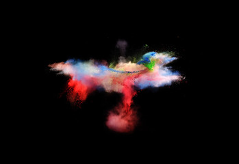 Bizarre forms of powder paint and flour combined  together explode in front of a black background to give off fantastic  multi colored cloud forms.