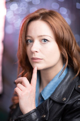 Naklejka premium Portrait of white skin ginger girl with blue eyes with leather jacket