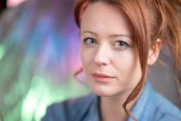 Portrait of white skin ginger girl with blue eyes with denim shirt