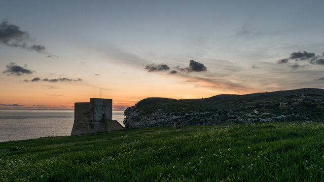 Mgarr Ix-Xini Bay Tower Gozo. Malta. Horizontal at sunset