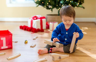 Toddler boy in his house around Christmas time