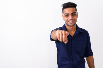 Naklejka premium Studio shot of young Indian businessman against white background