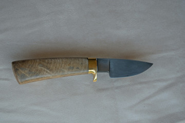 A soft damascus pattern can be seen in this pretty fixed blade knife.