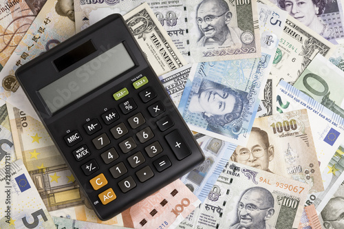 Calculator On International Banknotes From World Major Countries Calculator On International Banknotes From World Major Countries Using As Forex Or Financial Economy Background