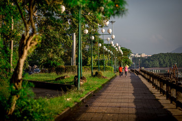 Chaofah Park, the morning, people jogging, in the harbor area, the waterfront community, Tourist Infomation Building, is a landmark. And can be used in the city of Krabi, Thailand.
