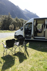 Camp chairs outside a campervan in the Fjordland National Park
