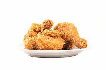 Fried chicken on a plate isolated on white