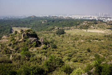 Fototapeta premium View from the Top of Golconda Fort at the Surrounding Gardens and the Modern Area of the City in Hyderabad, India