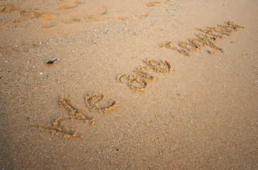 we are together message written in sand