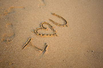 love message written in sand
