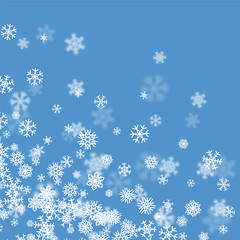 Christmas snow background with scattered snowflakes falling in winter