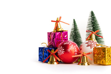 Christmas background concept. Christmas gift box and tree with golden bells, pine cones, red and white ball on white background