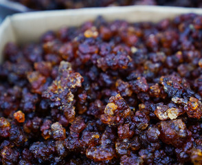 In the street selling peach gum