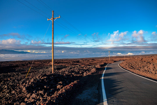 Road above clouds near Mauna Loa mountain, Hawaii