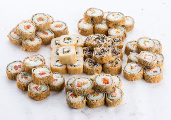 Sushi set and composition at white background. Japanese food restaurant, sushi maki gunkan roll plate or platter set.