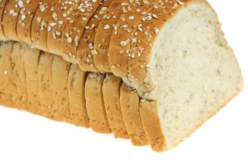 close up on whole grain sliced bread on white background