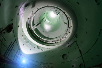 Inside unfinished reactor vessel of abandoned nuclear power plant. Bottom view of metal dome