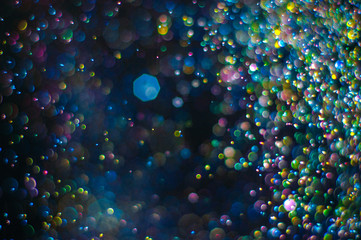 Obraz na płótnie Canvas Abstract background with glittering color particles
