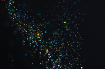 Abstract background with glittering color particles