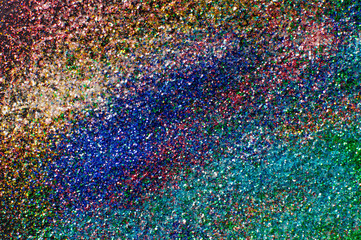 Abstract background with glittering color particles