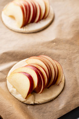 Cooking process of galetta, biscuit with apples on paper background. Apple pie with cinnamon.