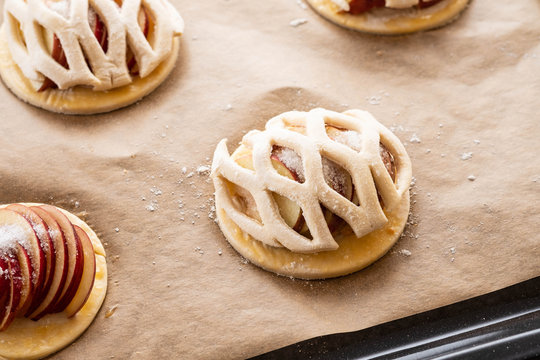 Cooking process of galetta, biscuit with apples on paper background. Apple pie with cinnamon.