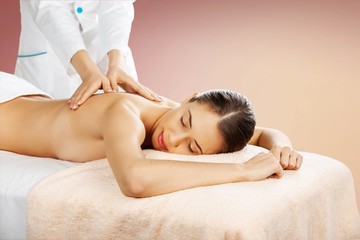 Fototapeta premium Beautiful young woman relaxing with massage at