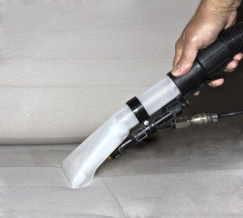 Professional cleaning of the upholstery on a sofa