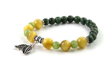 Colorful gemstone bracelet with silver leaves isolated on white background. Cat's eye - tiger's eye and jade gemstone beads.
