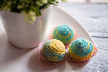 Red Bean Spiral Thousand Layer Mooncake- Pastry-style mooncakes are filled with sweetened red bean paste and made with coconut oil and colored with natural juice from blue pea flowers. Selective focus