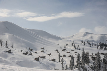 Amazingly beautiful winter landscape of snow covered hills with houses