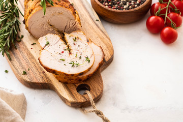 Christmas Turkey Breast Roll Stuffed with Cheese, Cranberries and Herbs, copy space.