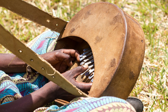 Man playing a mbira, traditional shona musical instrument