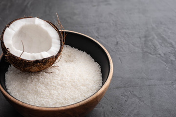 Beautiful composition with coconuts on black background. Copy space.