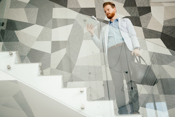 Businessman having tablet and phone at hand