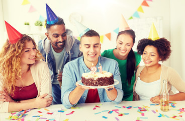 corporate party and people concept - happy team with cake and non-alcoholic drinks celebrating colleague 21st birthday at office