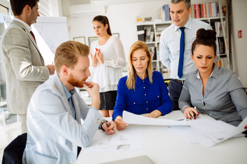 Fototapeta premium Group of business people working as team in office