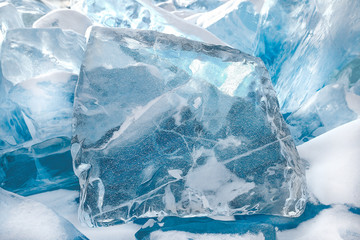 Beautiful transparent blue ice blocks, winter background, close-up view