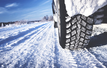 Closeup of car tires in winter morning