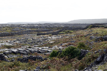 Fototapeta na wymiar A view of the geological landscape of the Aran Islands with karst limestone rock created by glacier deposits