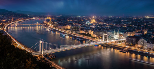 Fototapeta na wymiar Budapest, Hungary - Aerial panoramic skyline of Budapest at blue hour. This view includes Elisabeth Bridge (Erzsebet Hid), Szechenyi Chain Bridge, Parliament and St. Stephen's Basilica