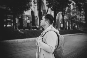 Sad alone lonely guy at city street. Concept of loneliness among young people. Depression and stress, crisis of mans life 