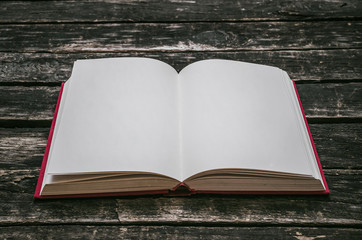 Open book with empty blank pages on the table.