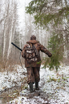 hunter in the forest in early winter