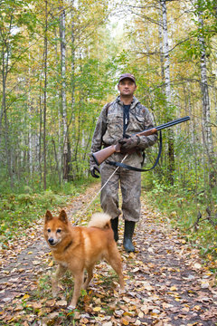 hunter with a dog on a leash