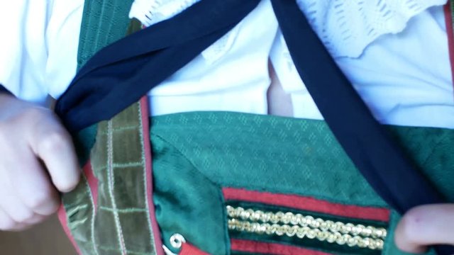 girl dresses a complex Tyrolean dress, typical of the traditional alpine areas of Tyrol