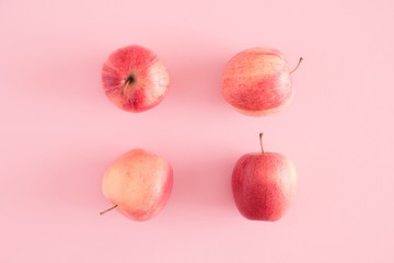 Autumn composition. Apples on pastel pink background. Autumn, fall creative concept. Flat lay, top view, copy space 