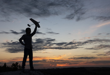 children with airplan toy outdoors