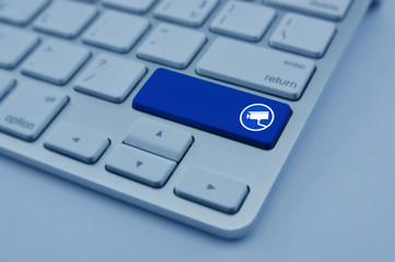 cctv camera flat icon on modern computer keyboard button, blue tone, Business security and safety online concept