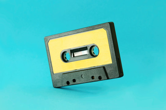 Retro cassette tape over blue background. top view. copy space.